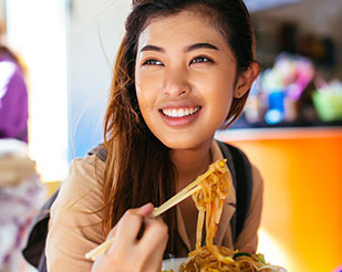 Woman eating noodles