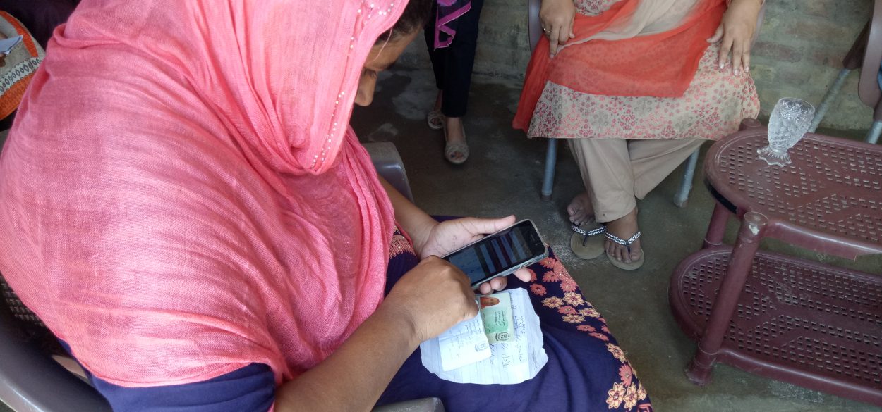 Woman registering birth on her phone