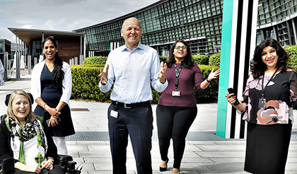 CEO Sigve Brekke and employees outside the Telenor office at Fornebu, Norway