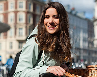 Woman on a bike smiling