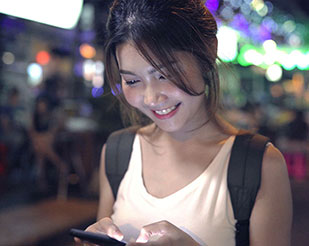 Asian woman looking at her phone