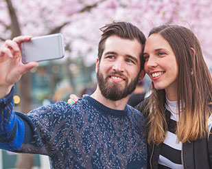 Man and woman taking a selfie 