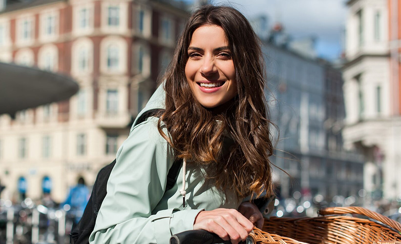 Woman on a bike smiling