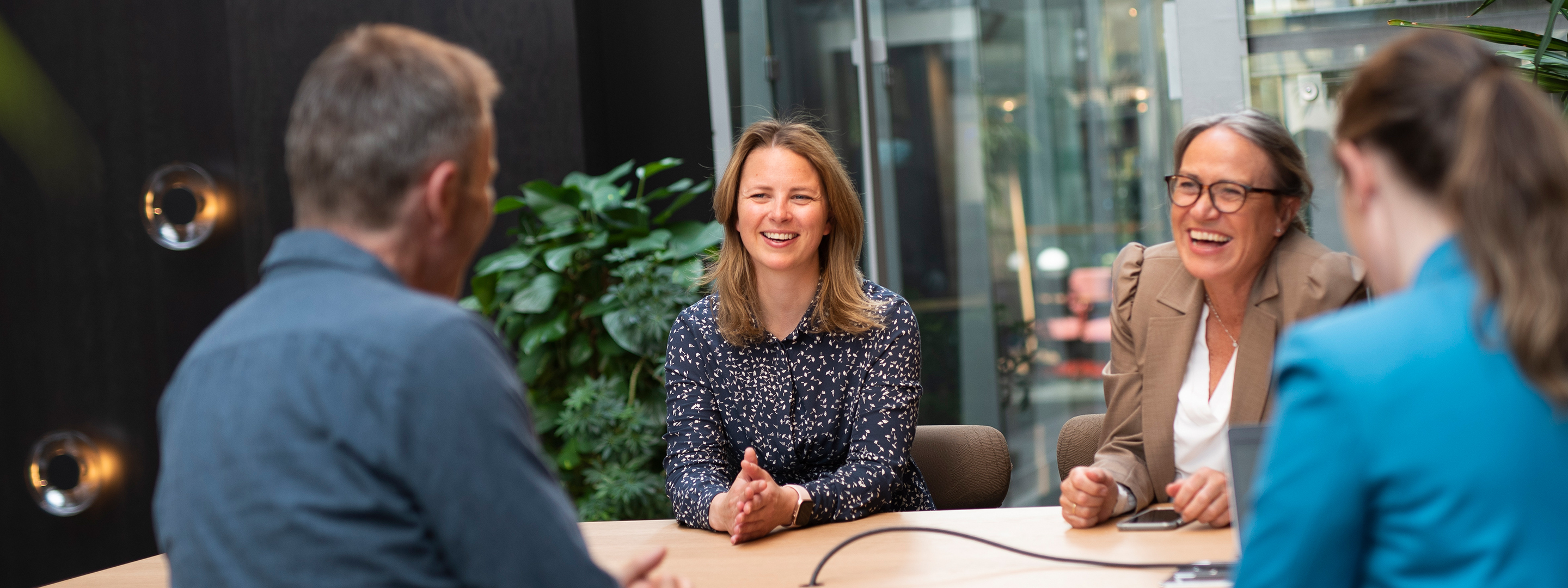 Employees talking and smiling together