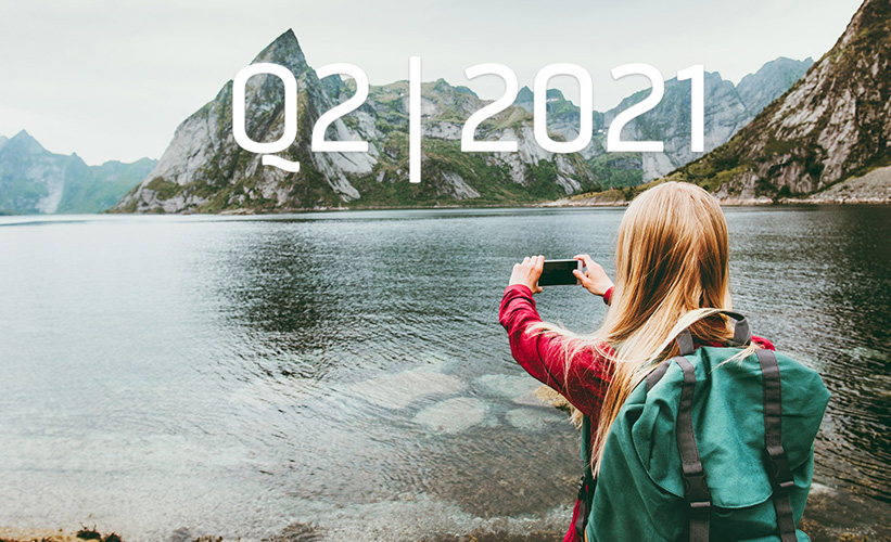 Woman taking a photo of nature in Norway