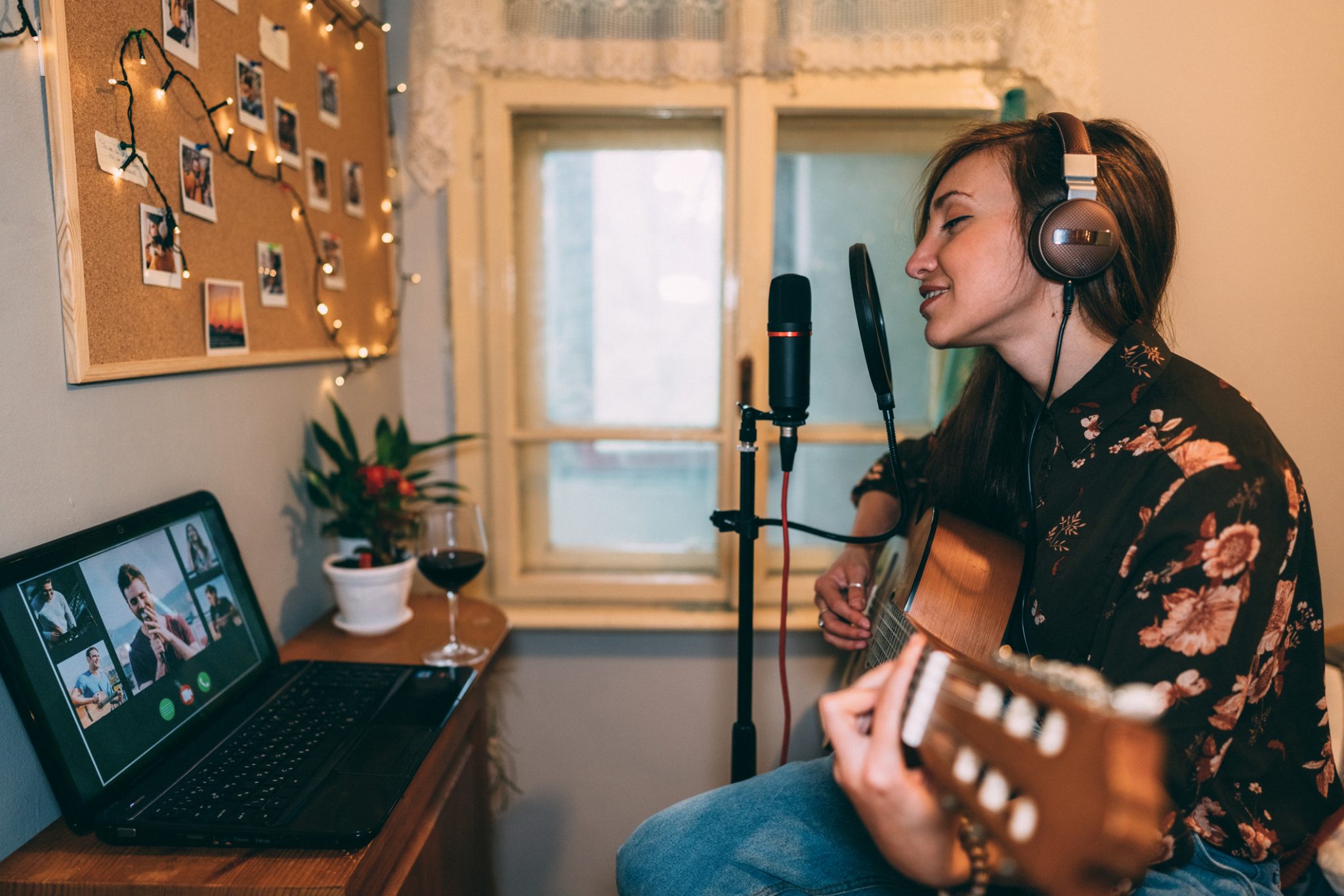 Woman playing the guitar online