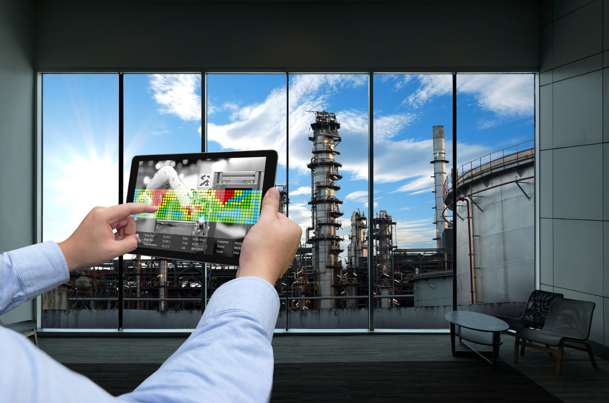 Man using his tablet at a factory