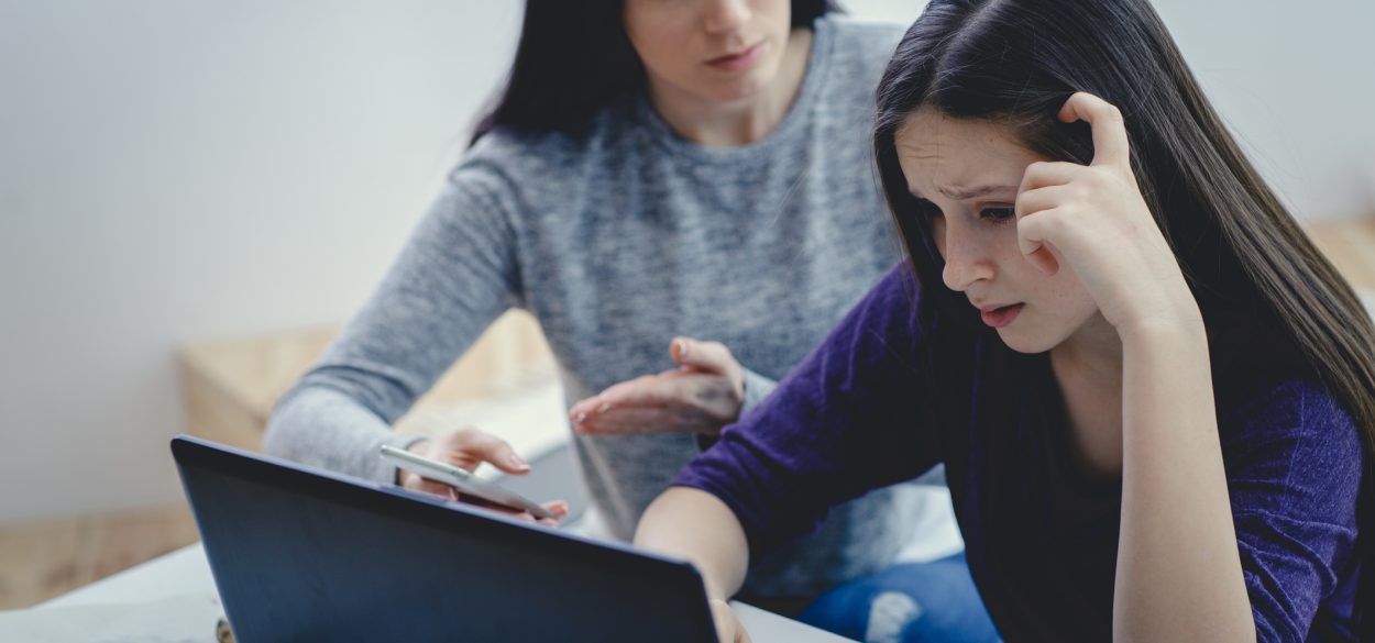 Two woman in front of a computer